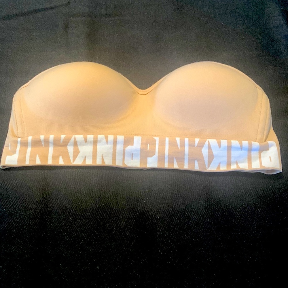 Pink extra small strapless bra, beige color., with padded bra areas.